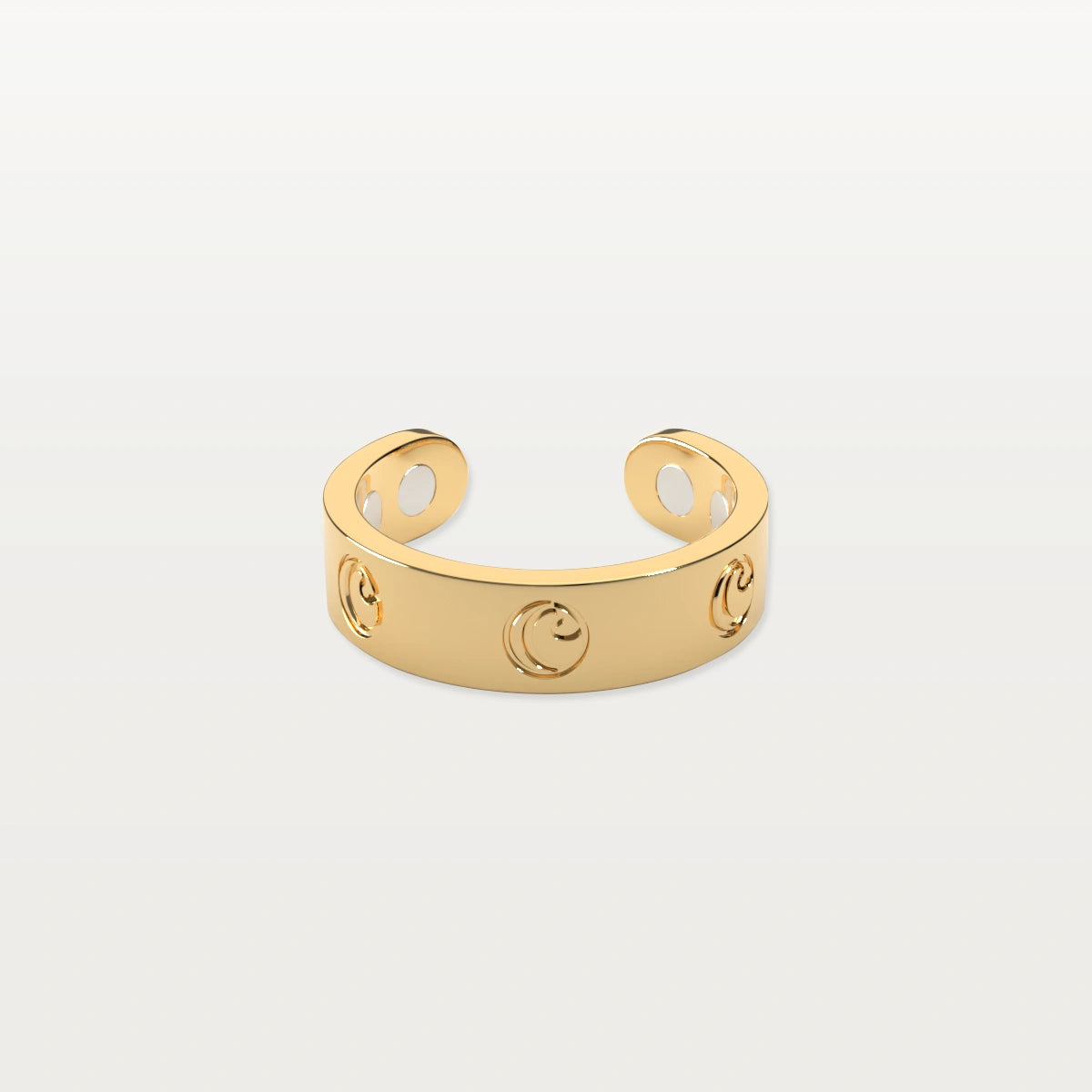 Gold open band ring with circular cutout design on white background.