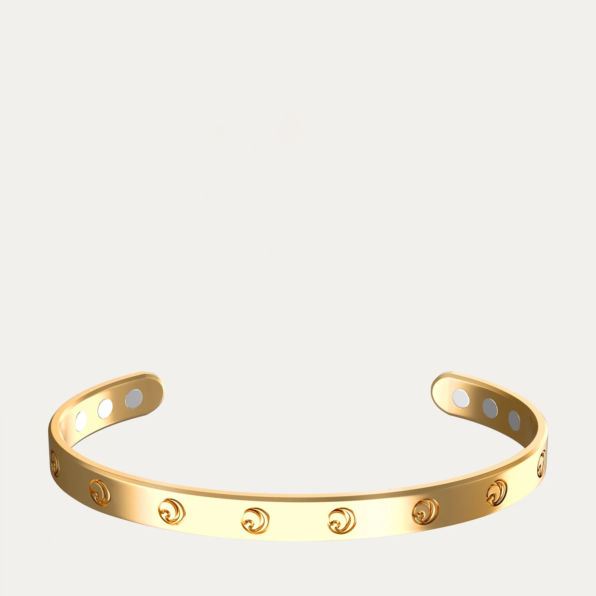 Gold bracelet with circular engravings, open design on a white background.